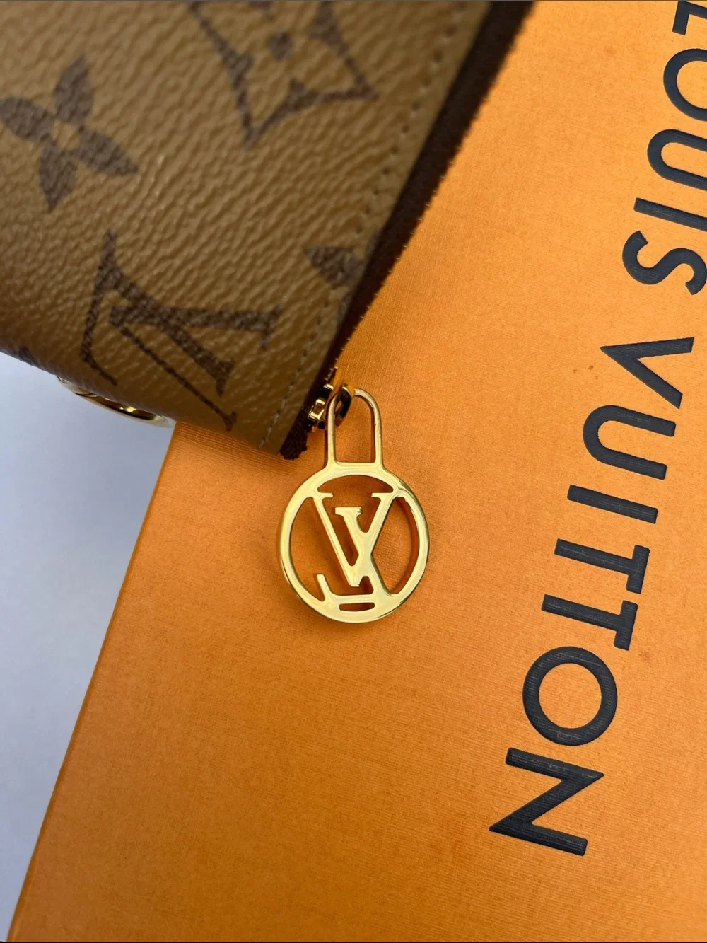 Louis Vuitton LV monogram reverse square pouch from Trio Pouch